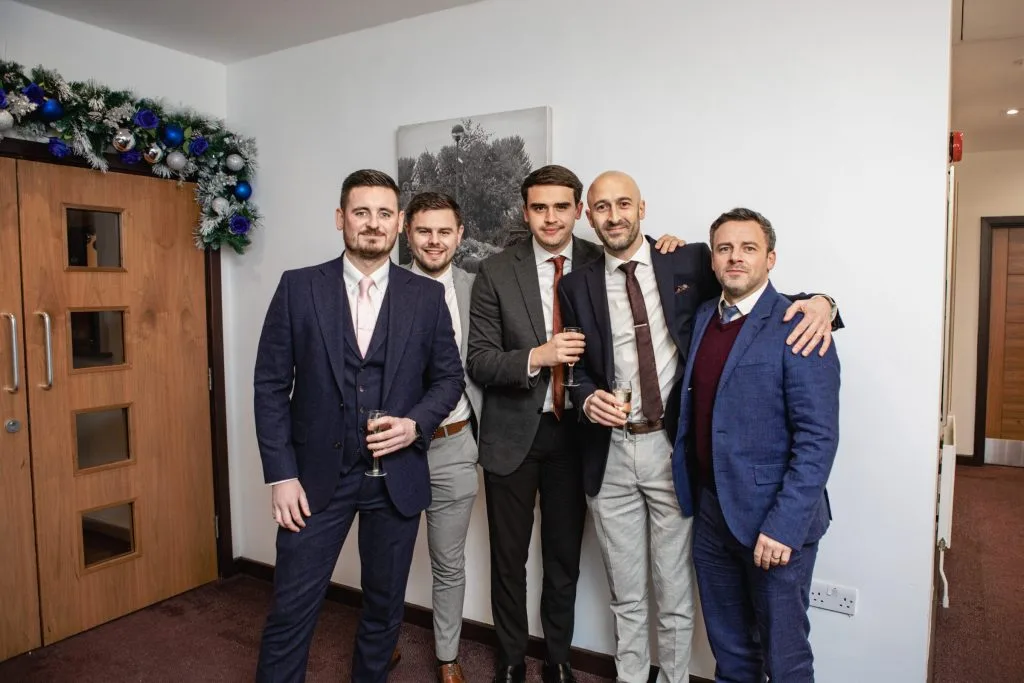 Group gathered for a photo at a function venue in dartford