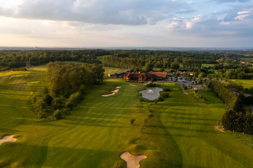 Drone footage of Birchwood Park with bunkers and skyline