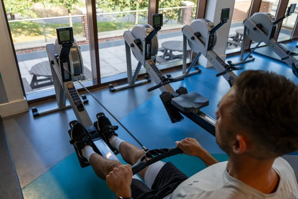 gym members using rowing machine in gym in dartford