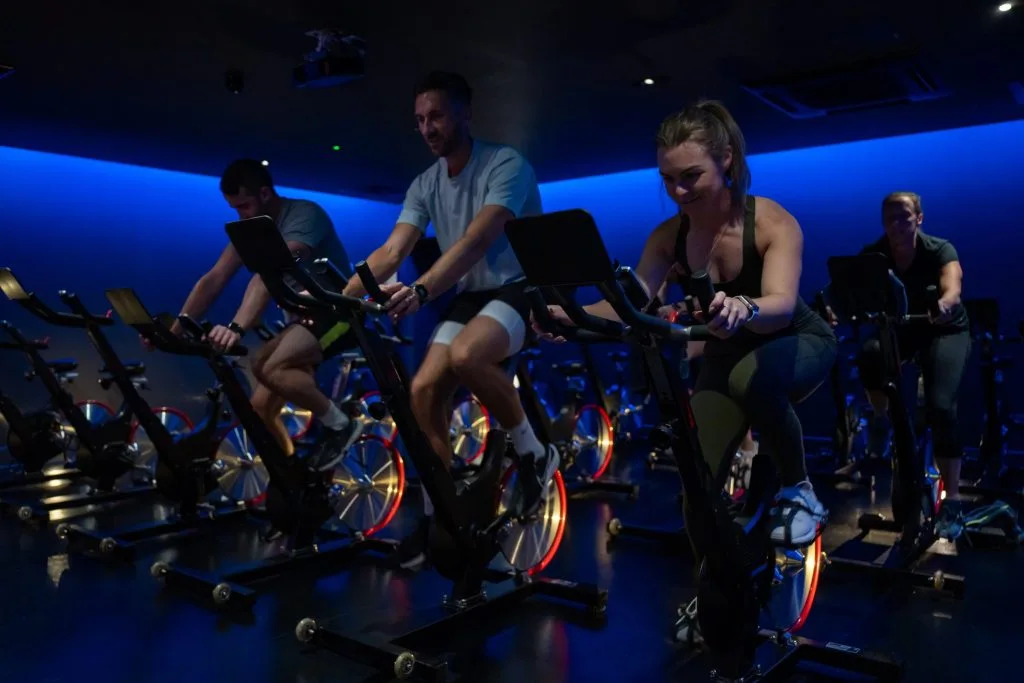 Three people doing a spin class at Birchwood Park