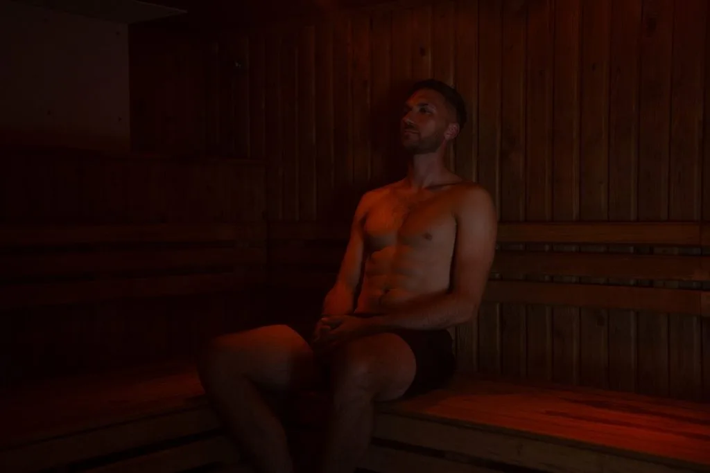Man relaxing in sauna at country club in kent