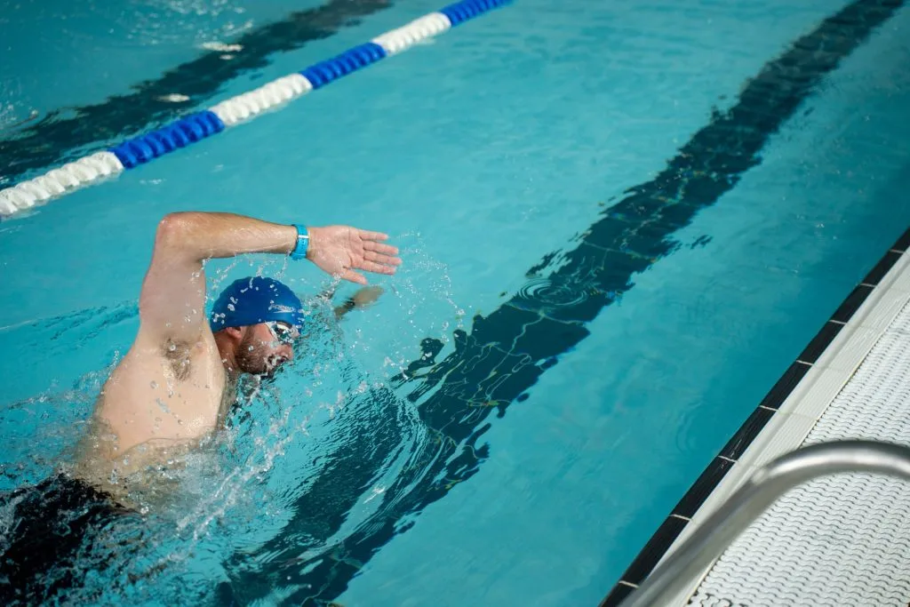 Man swimming in lane at swimming pool in swanley