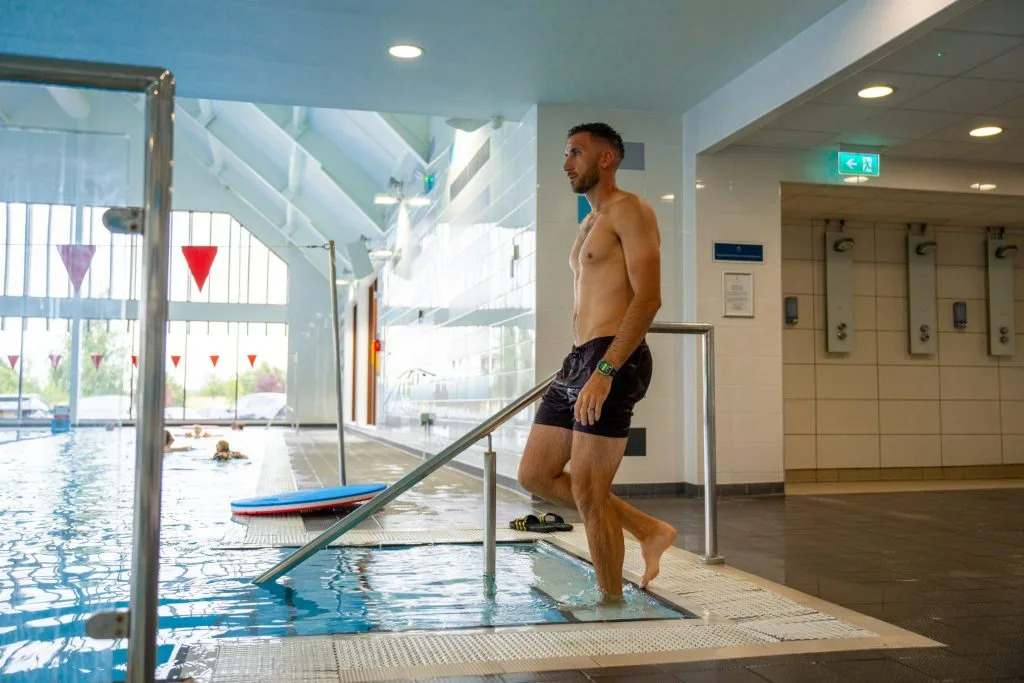 Man entering the swimming pool at Birchwood Park