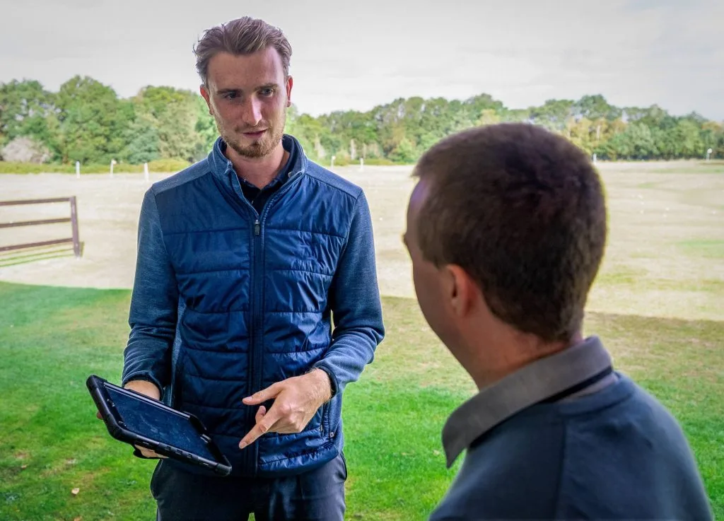 Two men having a custom fit consultation in kent