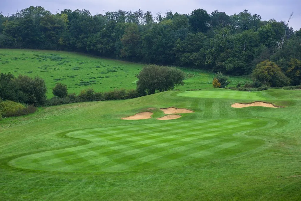 freshly cut golf course with flag in kent